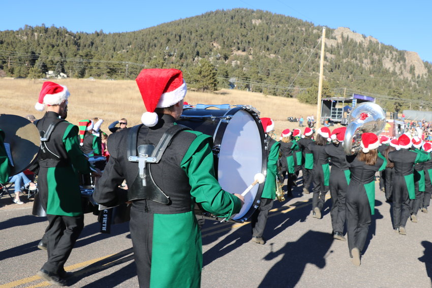 The Lobos marching band performs in the parade.